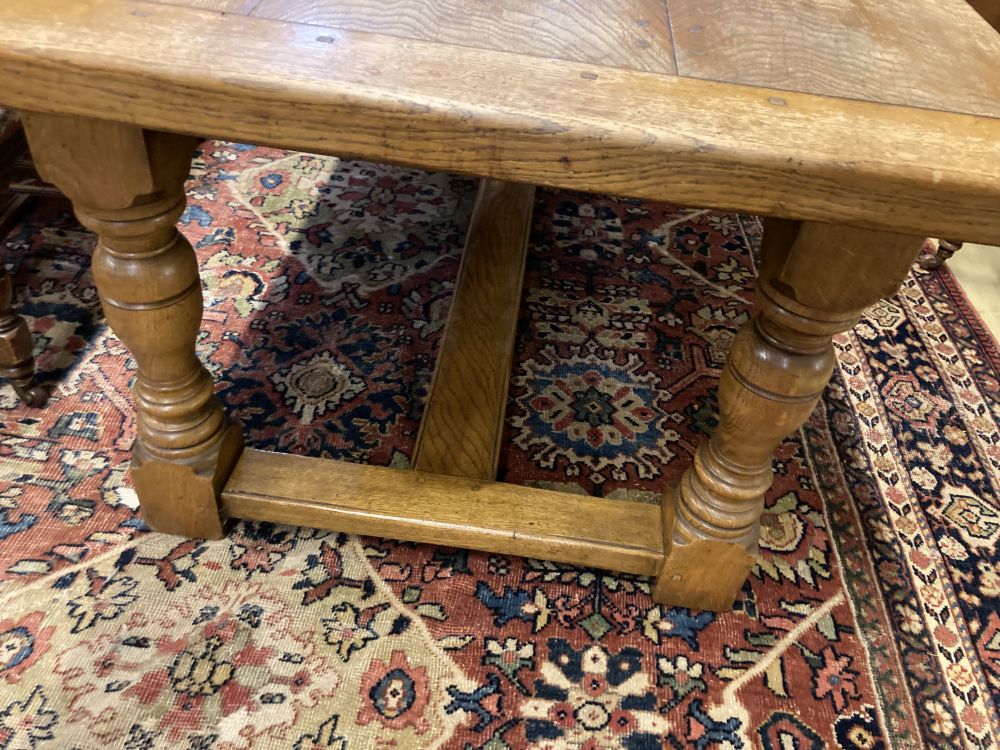 An 18th century style oak refectory dining table, 230 x 93cm height 77cm
